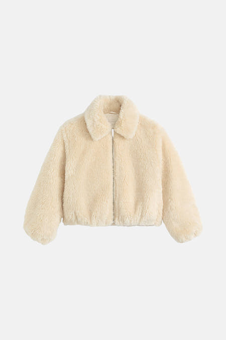 Veste courte beige de Levi's, avec des manches longues, un col et une fermeture à glissière devant.