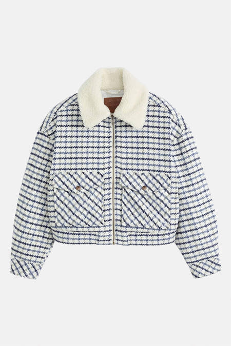 Veste multicolore de Levi's® avec une col teddy blanc, un motif à carreaux et des poches avec des boutons.