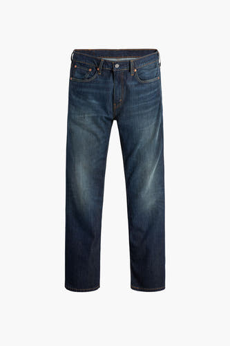 Jean bootcut en denim de Levi's®, avec un délavage foncé classique et des zones d'usure subtiles.