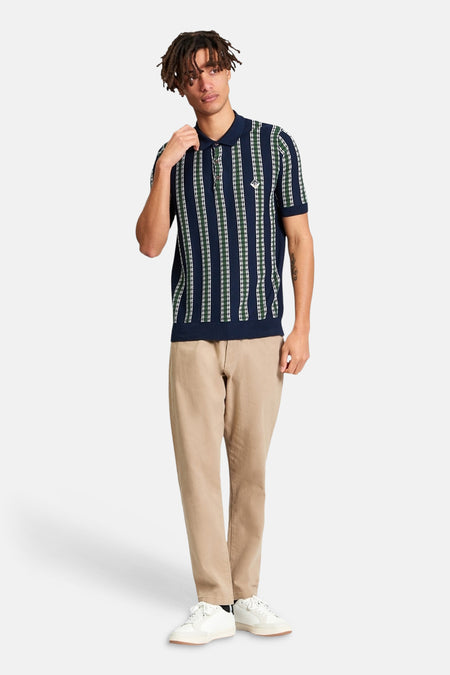 Blauw poloshirt van BEN SHERMAN met verticale strepen in groen en wit.