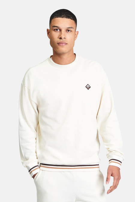 Pull écru de BEN SHERMAN, à manches longues et poignets rayés.