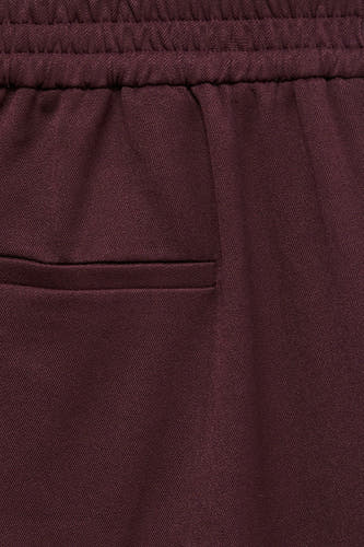 Pantalon Bordeaux VERO MODA® avec ceinture élastique et poches passepoilées.
