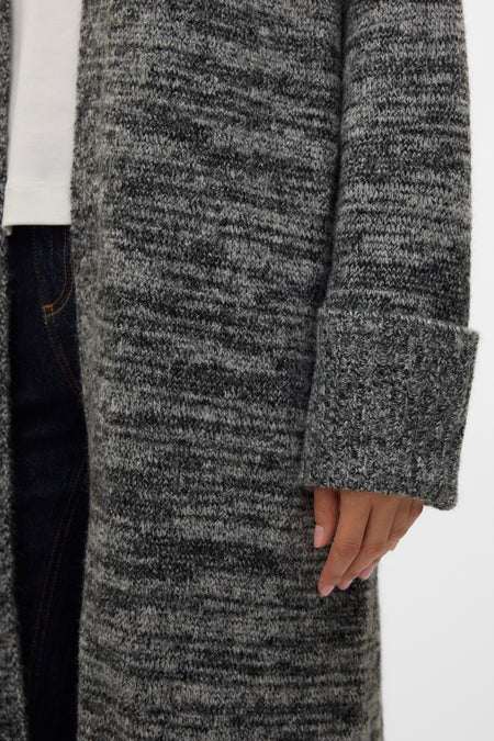 Gilet noir VERO MODA® avec longues manches et un motif de bretelles mélangé.
