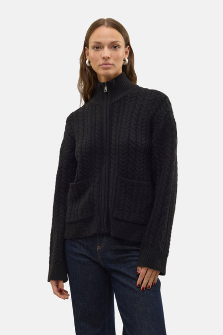 Veste noire avec fermeture éclair de VERO MODA, à motif côtelé et poches avant.