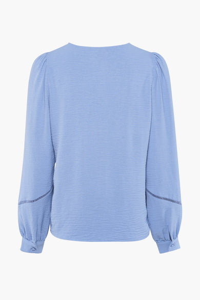 Blauwe blouse met lange mouwen van VERO MODA, met details van broderie en manchetten met knoop.