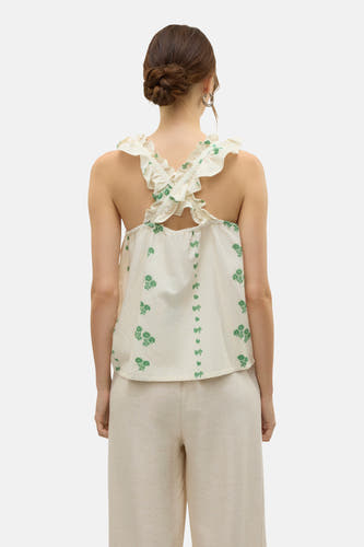 Blouse sans manches écru de VERO MODA avec motif floral vert et plis à l'arrière.