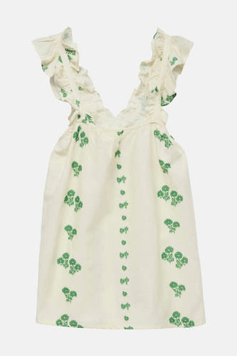 Blouse écru sans manches de VERO MODA, avec des motifs floraux verts et des volants aux épaules.
