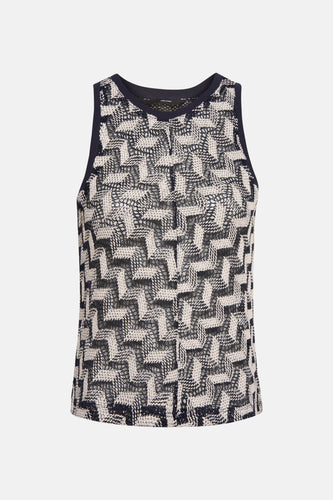 Mouwloze top met geometrisch patroon in marineblauw en ecru.