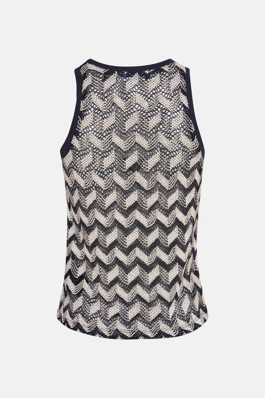 Zwarte en witte mouwloze top met zigzagpatroon.