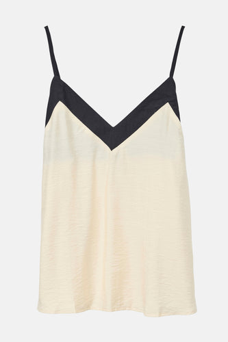 Crèmekleurige top met zwarte V-hals en spaghettibandjes.