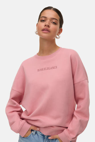 Gilet rose de VERO MODA® avec des manches longues et un col rond, portant le texte 'Rose Elegance'.