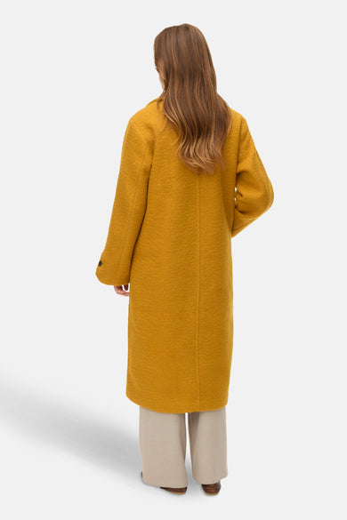 Manteau long de VERO MODA, vu de l'arrière, avec des manches longues et une coupe slimme.