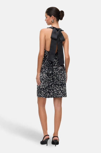 Mouloze zwarte jurk van VERO MODA®, met pailletten en decoratieve strik op de rug.
