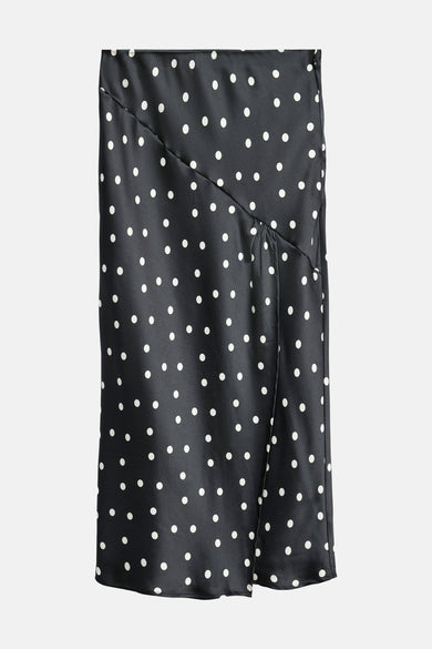 Longue jupe noire de VERO MODA® avec des taches blanches et une fente à l'avant.