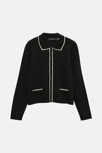 Gilet noir de Vero Moda avec longues manches, biais blanc et fermeture à boutons.