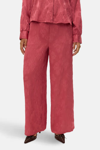 Pantalon rose de VERO MODA®, avec imprimé floral et jambes larges, vu de derrière.