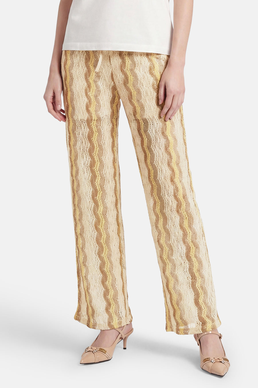 Pantalon multicolore de VERO MODA® avec des rayures ondulées dans des tons beiges et jaunes, en maille ajourée.