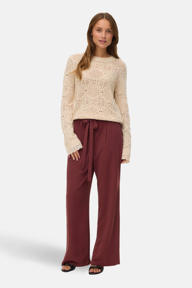 Bruine broek van Vero Moda, met een strikceintuur en wijde pijpen.