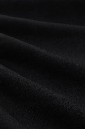 Jean en denim noir droit de TOM TAILOR, avec des plis doux dans le tissu.