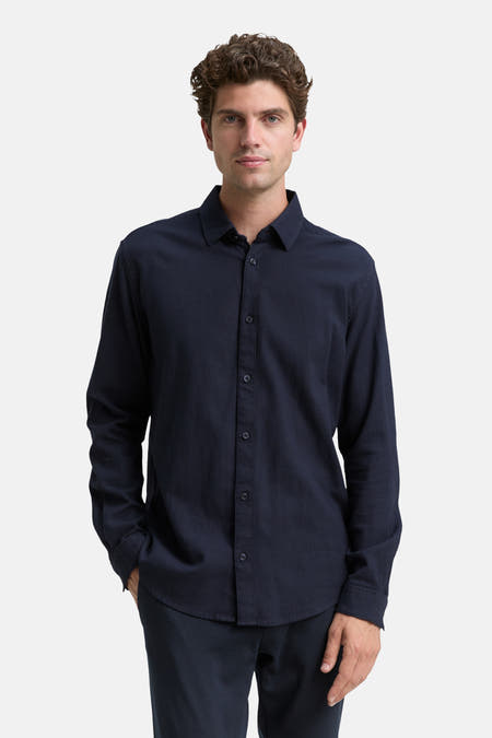 Chemise bleue à manches longues de TOM TAILOR, avec une subtile texture et une fermeture à boutons.