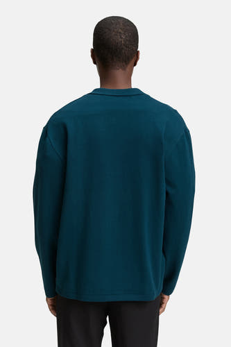 Gilet turquoise de TOM TAILOR, vu d'arrière, avec un col et des manches longues, porté sur une jupe noire.