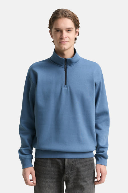 Pull-over bleu de TOM TAILOR, avec une fermeture éclair courte et un col rond.