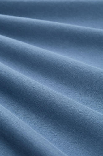 Gilet bleu de TOM TAILOR avec une fine texture tissée et des plis subtils dans le tissu.