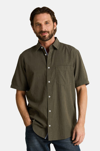 Chemise à manches courtes TOM TAILOR, à pois blancs, portée par un homme en jean, vue de dos.