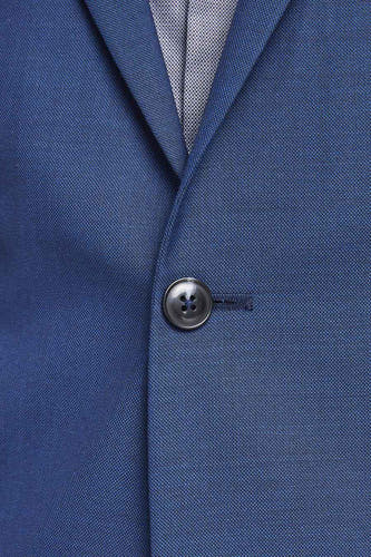 Blazer bleu de PREMIUM par JACK & JONES, avec une fine texture et un col boutonné.
