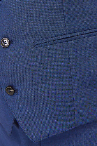 Gilet bleu de PREMIUM par JACK & JONES, avec fermeture à boutons et poche détail.