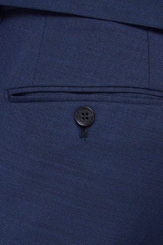 Pantalon de costume bleu PREMIUM by JACK & JONES, avec une poche à boutonnière sur l'arrière.