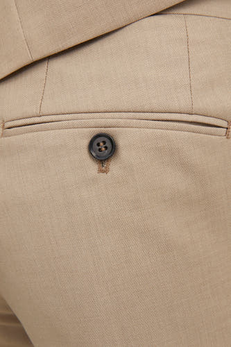 Pantalon de costume beige PREMIUM by JACK & JONES, avec une poche à boutonnière.