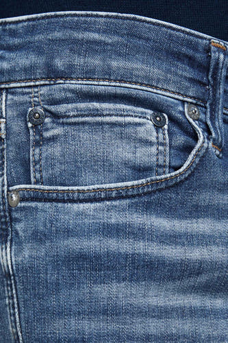 Jean slim fit bleu moyen de JACK & JONES JEANS INTELLIGENCE, avec poches et détails métalliques.