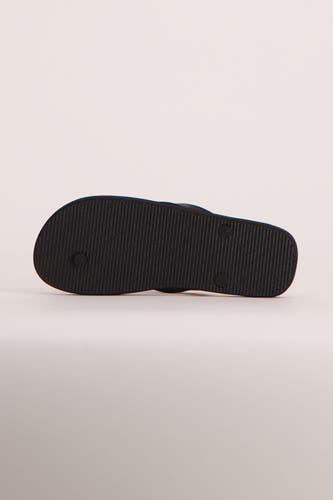 Tongs bleus de ACCESSORIES BY JACK & JONES avec une semelle noire texturée, vus par le dessous.