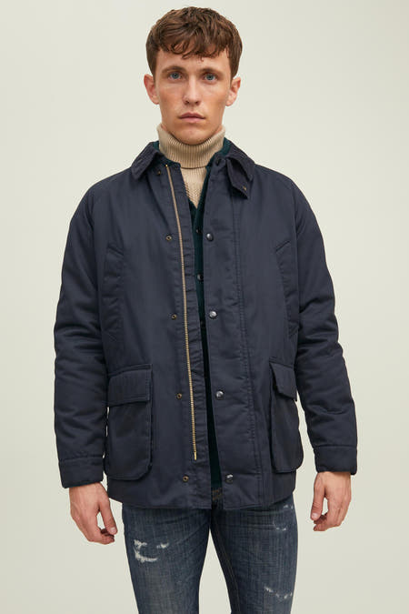 Veste courte bleue de PREMIUM BLUE by JACK & JONES, avec manches longues, poches et fermeture éclair dorée.