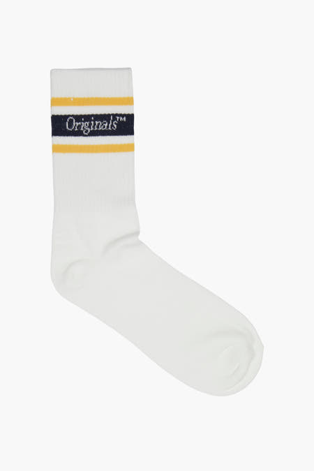 Chaussettes blanches d'ACCESSORIES BY JACK & JONES, avec des rayures jaunes et bleues.