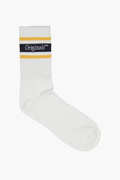 Chaussettes blanches d'ACCESSORIES BY JACK & JONES, avec des rayures jaunes et bleues.