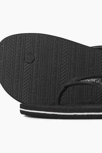 Chaussons gris d'ACCESSORIES BY JACK & JONES, avec une impression de logo sur la semelle.