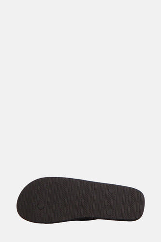 Chaussons noirs d'ACCESSORIES BY JACK & JONES, avec des logos répétés comme texture sur la semelle.