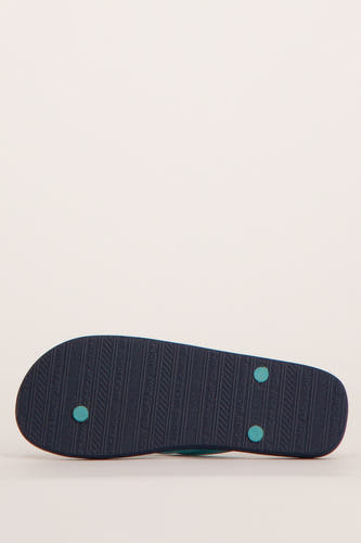 Chaussons bleus d'ACCESSORIES BY JACK & JONES, avec une semelle profilée dotant du logo de la marque.