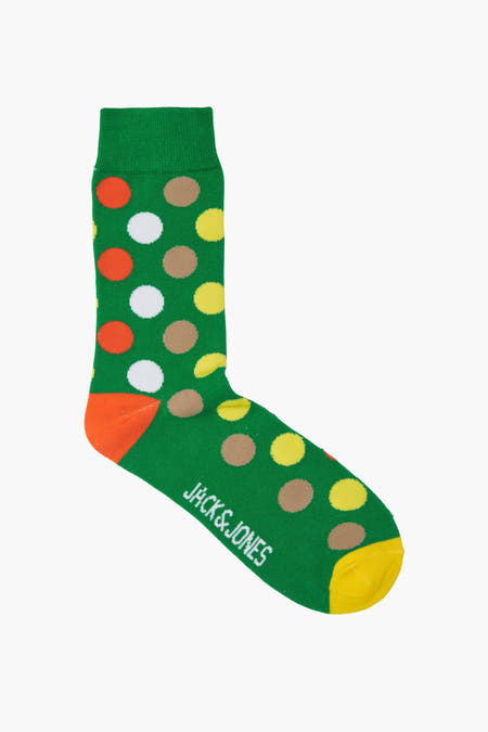 Chaussettes en coton vert d'ACCESSORIES BY JACK & JONES, avec orteil orange et points blancs, jaunes, oranges et bruns.