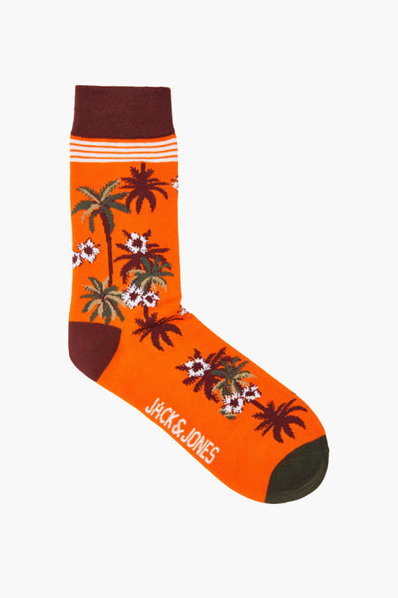 Chaussettes orange d'ACCESSORIES BY JACK & JONES, avec motif de palmier et de fleurs.