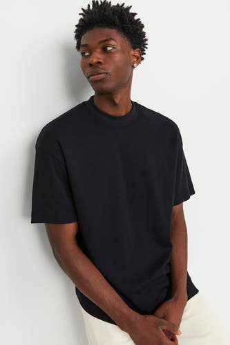 T-shirt noir à manches courtes de CORE BY JACK & JONES, couleur unie et coupe décontractée.