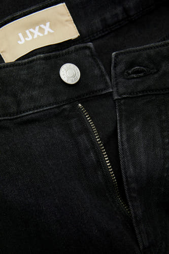 Jean en denim noir de JJXX, avec un nœud et une fermeture à glissière argentés.