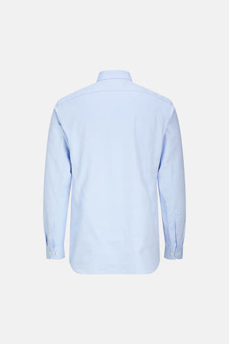 Chemise bleue à manches longues de PREMIUM by JACK & JONES, avec des boutons sur les poignets, photographiée par derrière.