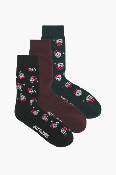 Chaussettes noires d'ACCESSORIES BY JACK & JONES, avec un motif de crâne de Noël et des chaussettes bordeaux lisses et vertes.