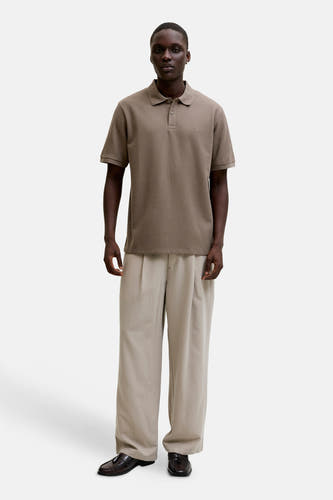 Bruine polo van CORE BY JACK & JONES, met korte mouwen en subtiel logo op de borst.