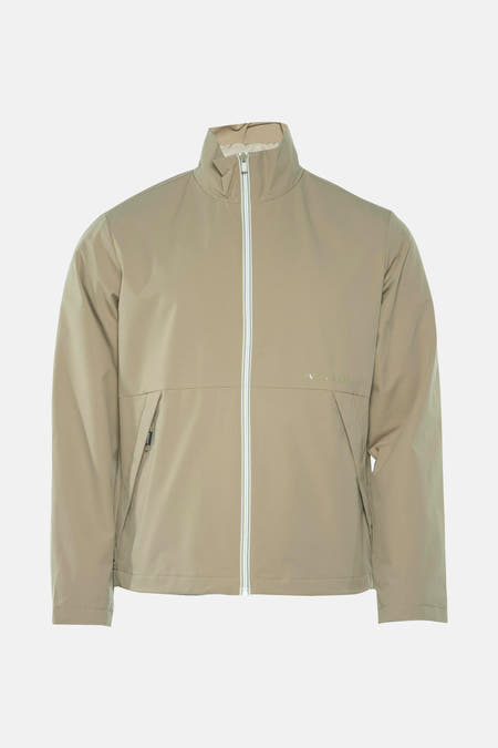 Veste courte beige de CORE par JACK & JONES, avec une fermeture éclair blanche et des poches.