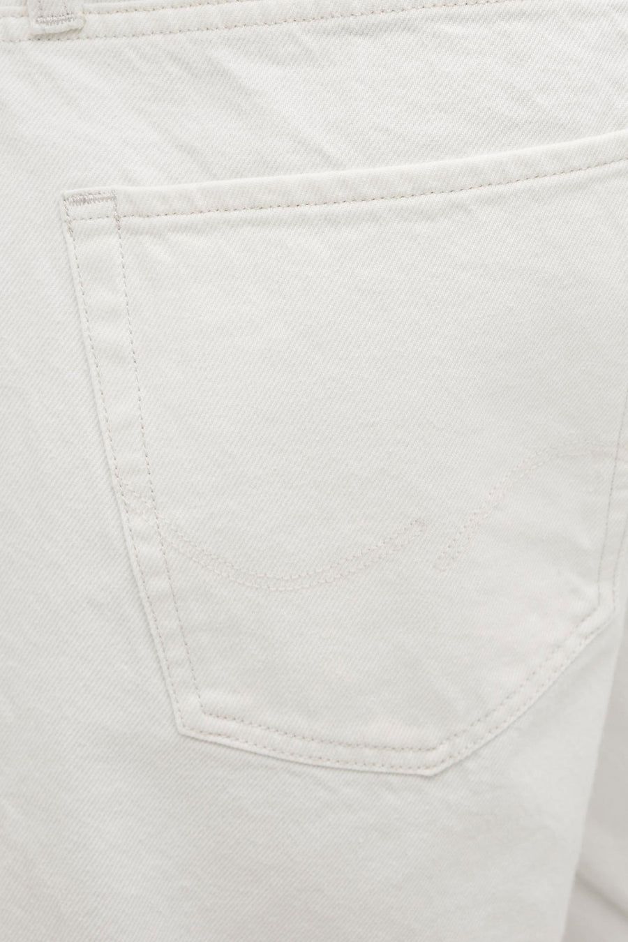 Witte denim broekzak met stiksels.
