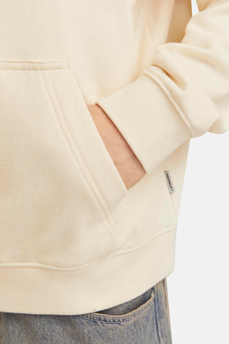 Crèmekleurige hoodie van jersey met capuchon en hand in zak.